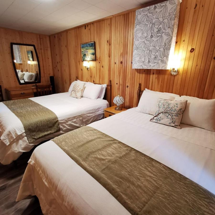 Knotty Pine Cottages, & Chalet Ingonish